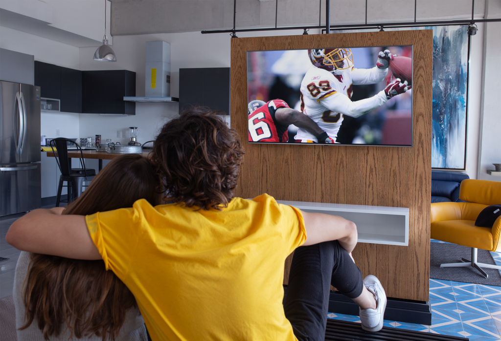 Couple Watching NFL Football play on TV