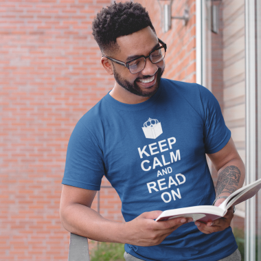 tshirt mockup of a smiling man reading in a balcony 21338